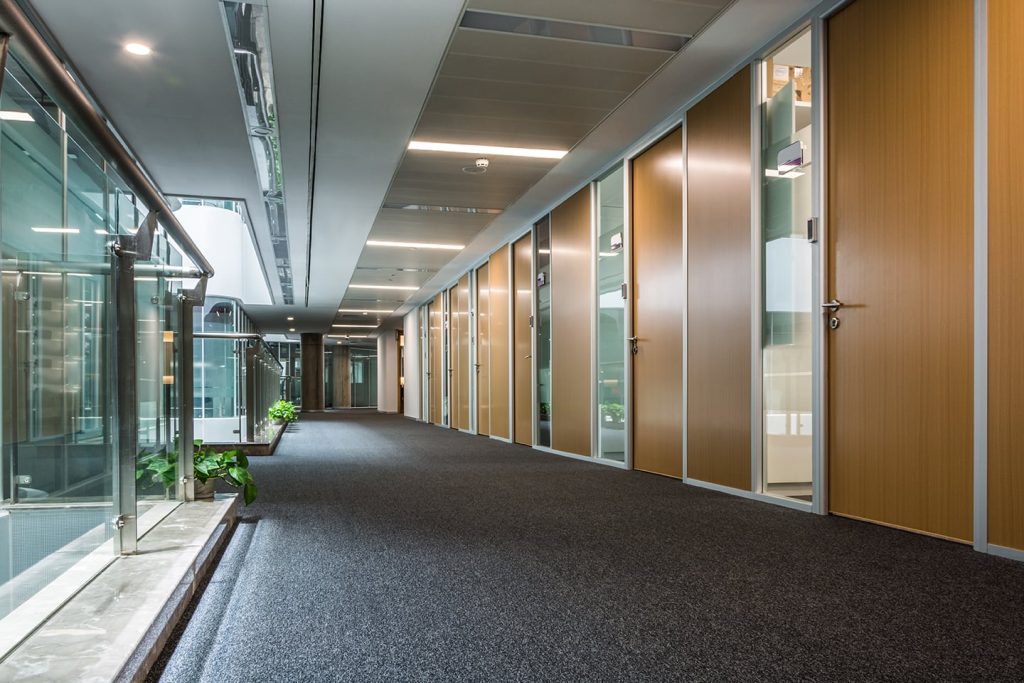 Interior shot of an office hallway with doors